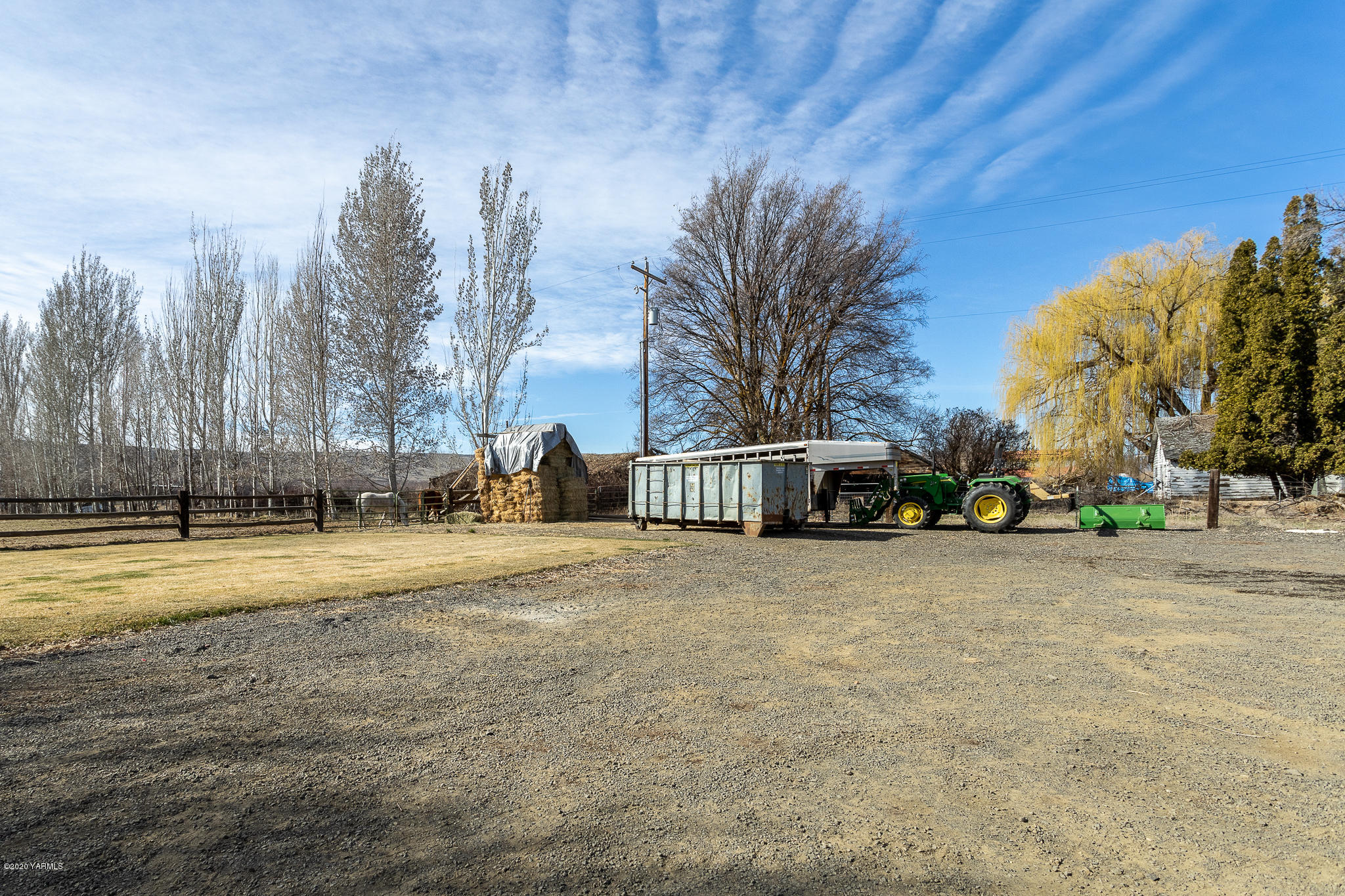 12100 Rutherford Road Yakima, WA 98903 - Photo 12 of 36 a front view of a house with a yard and trees