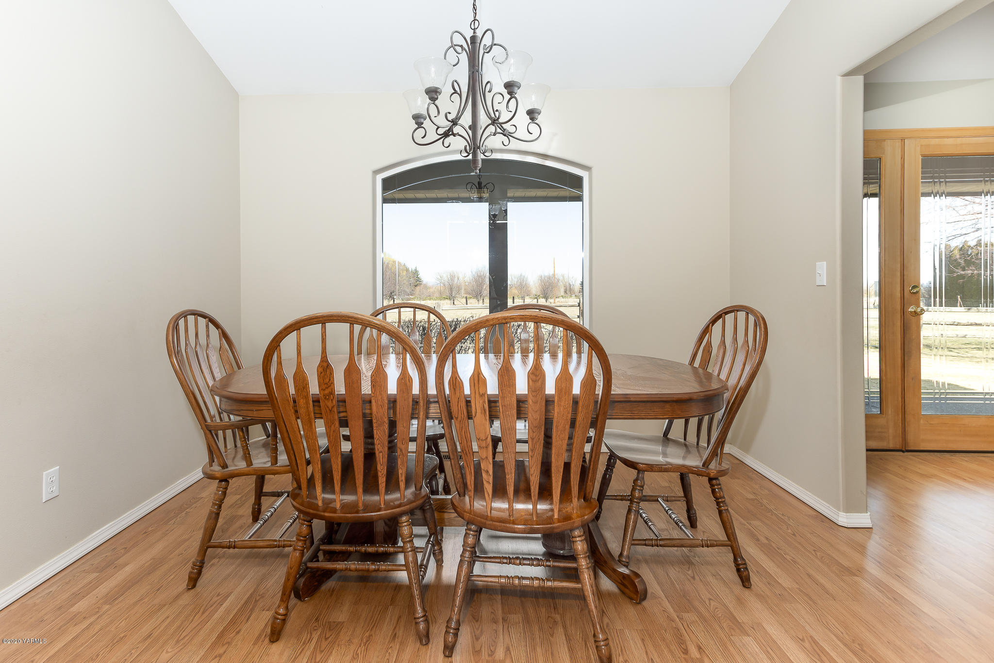 12100 Rutherford Road Yakima, WA 98903 - Photo 17 of 36 a view of a dining room with furniture window and wooden floor