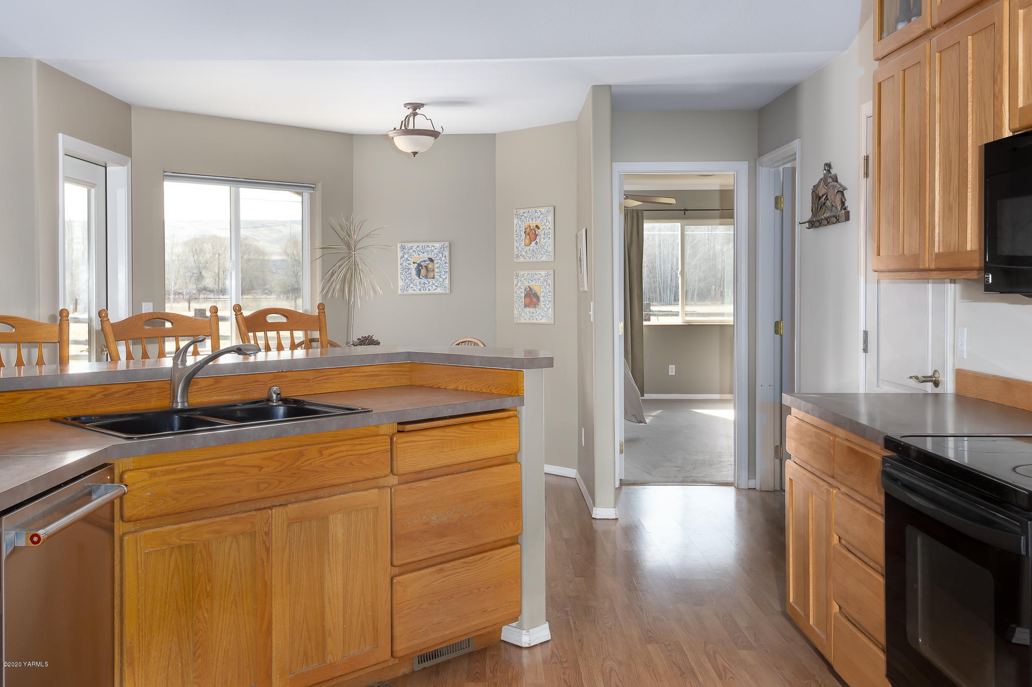 12100 Rutherford Road Yakima, WA 98903 - Photo 18 of 36 a kitchen with a sink and a refrigerator