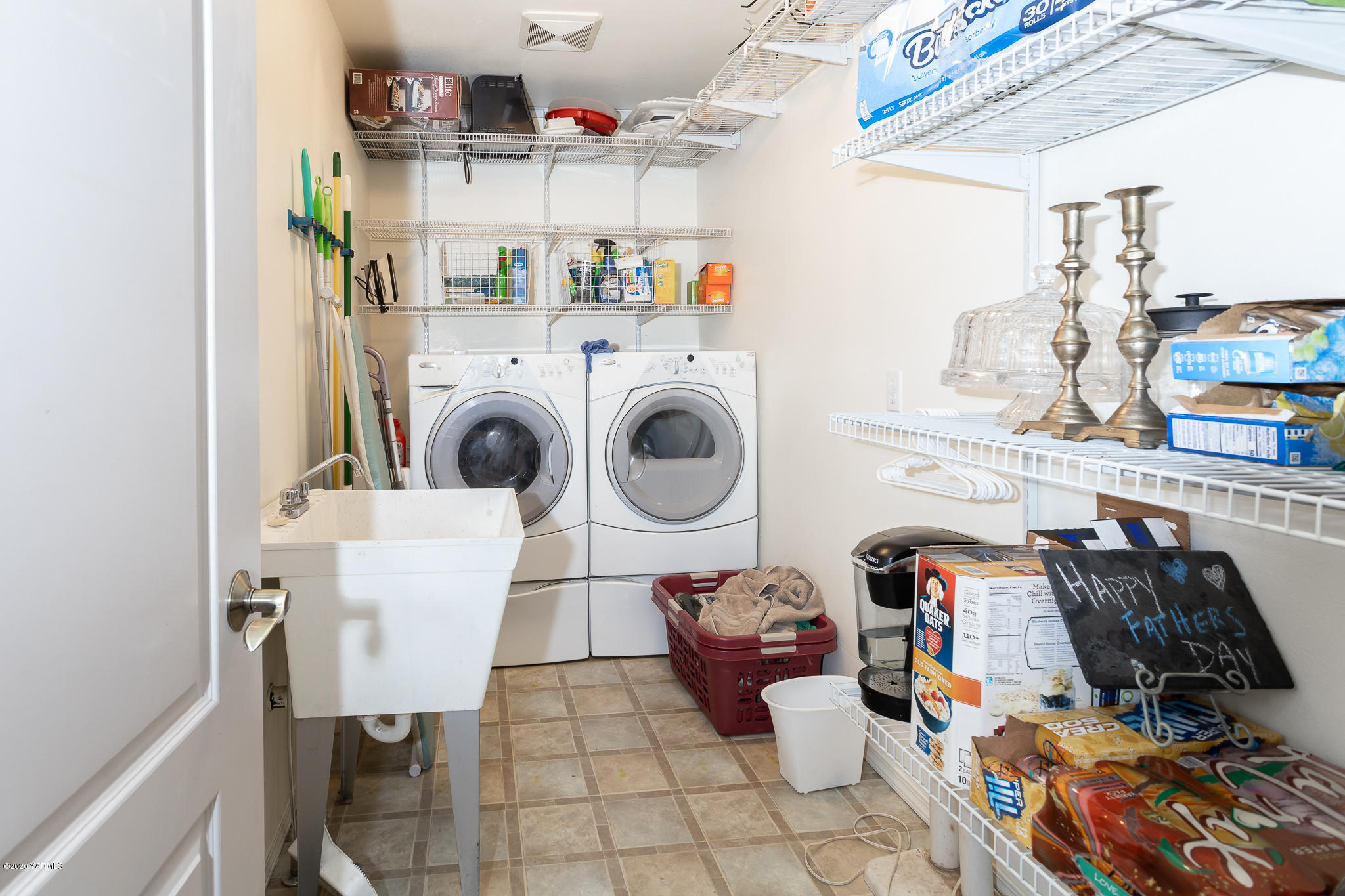 12100 Rutherford Road Yakima, WA 98903 - Photo 20 of 36 a utility room with dryer washer and a view of living room