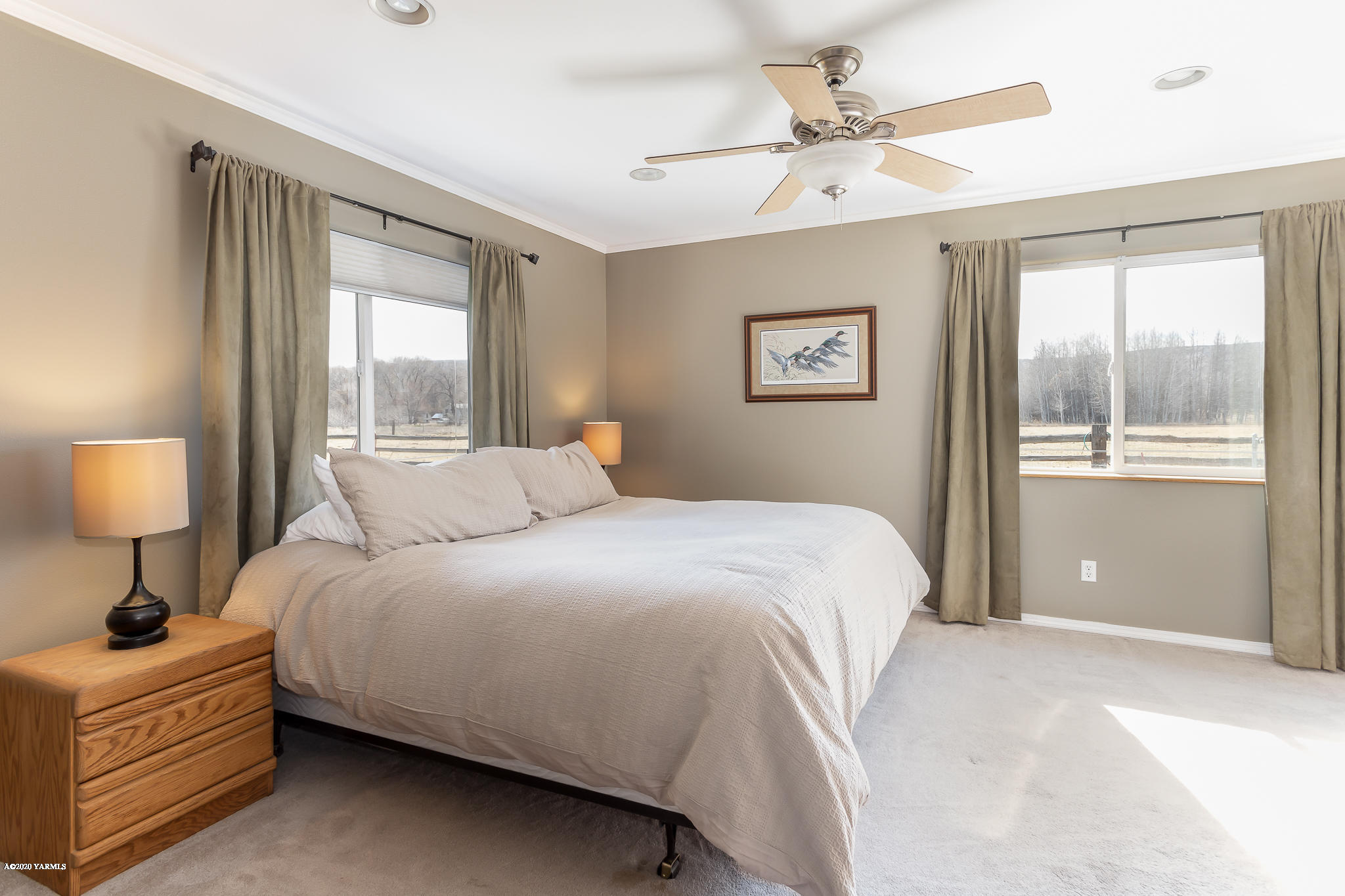 12100 Rutherford Road Yakima, WA 98903 - Photo 23 of 36 a bedroom with a bed and a window