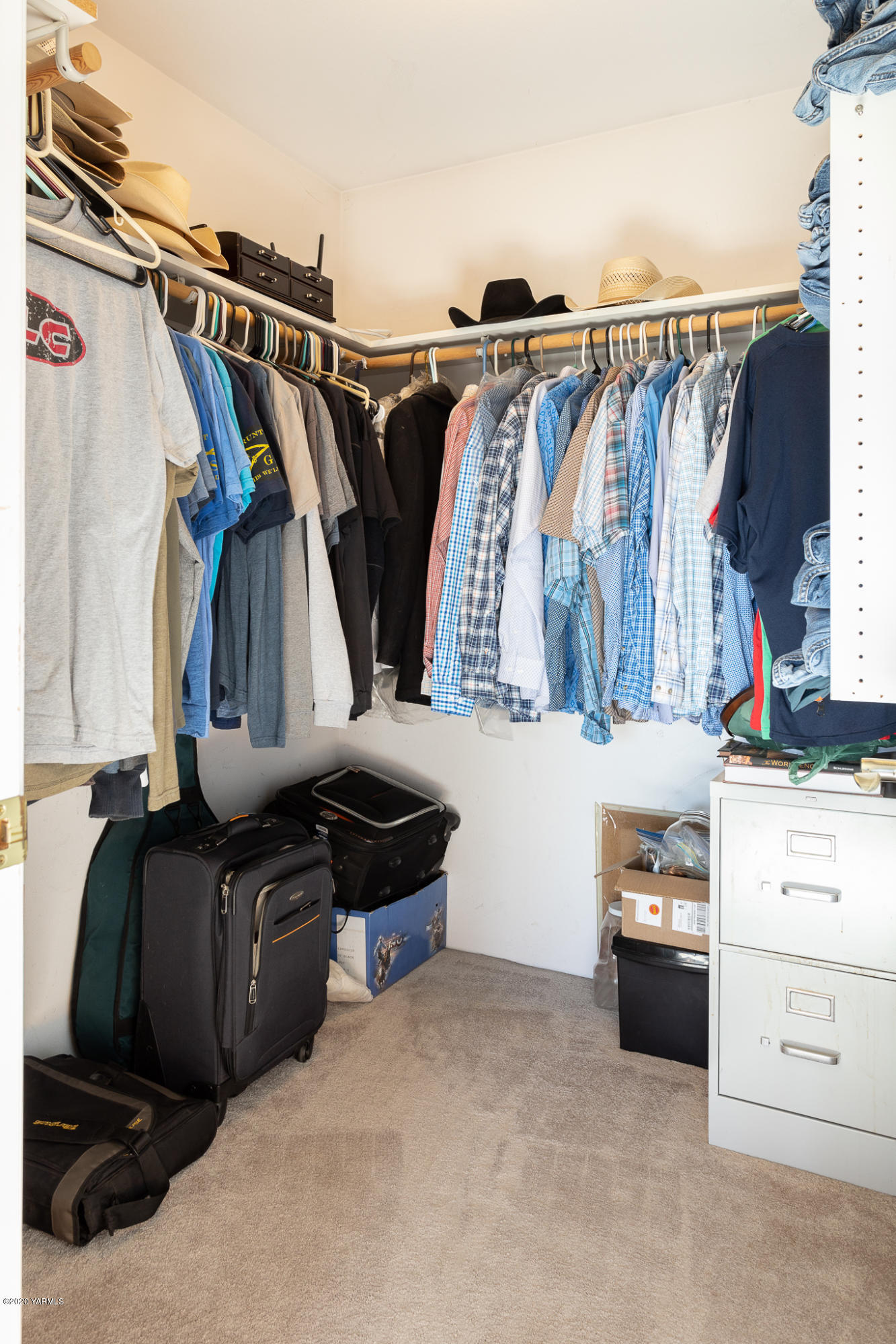 12100 Rutherford Road Yakima, WA 98903 - Photo 26 of 36 a walk in closet with wooden floor