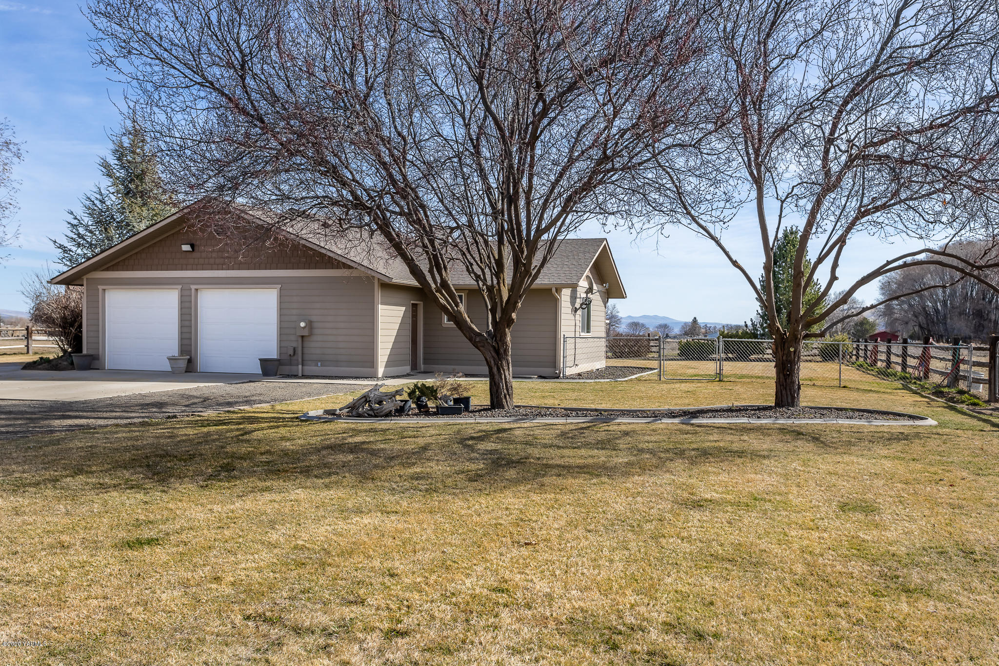12100 Rutherford Road Yakima, WA 98903 - Photo 5 of 36 a view of a house with snow on the side of the road