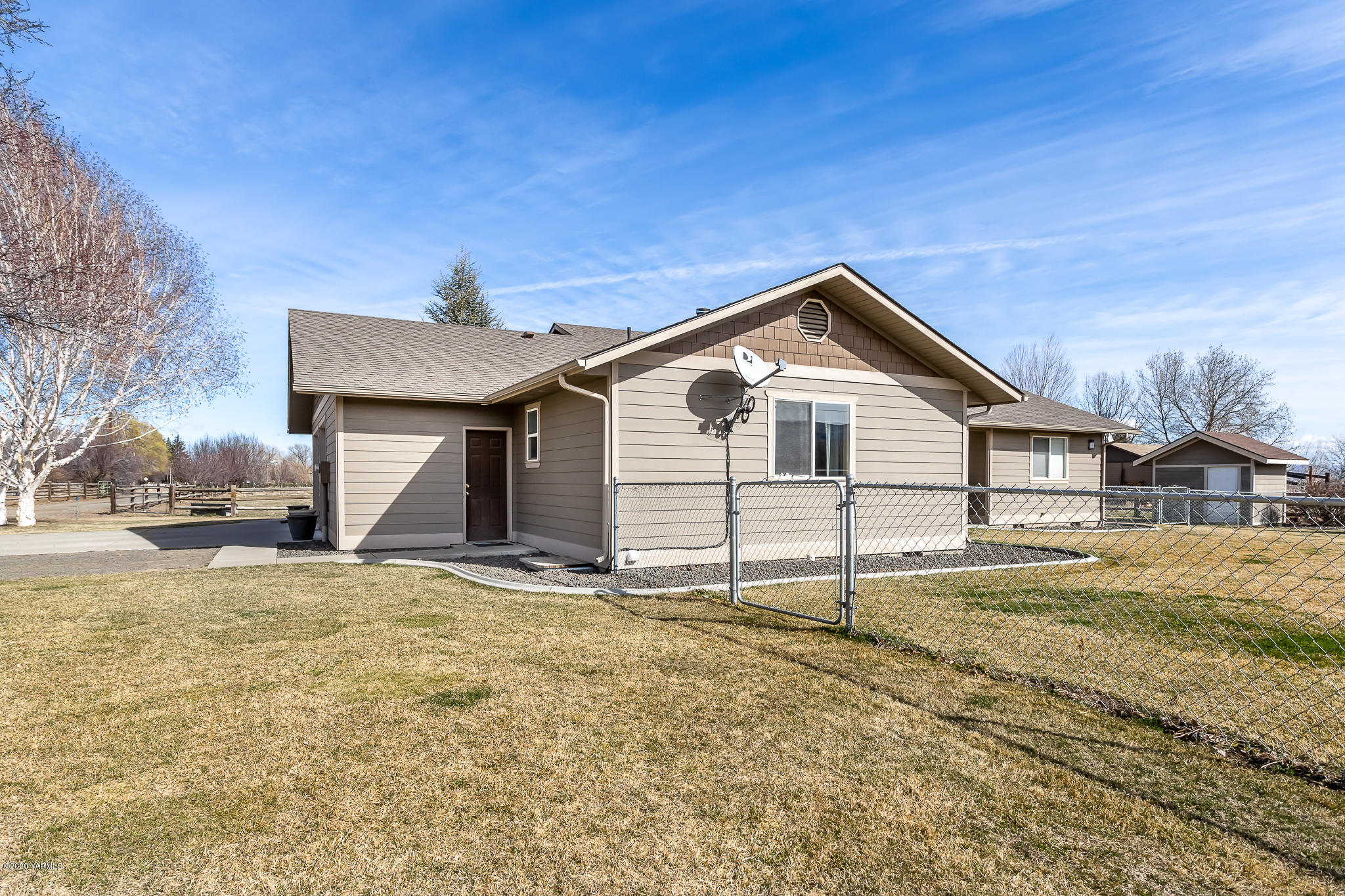 12100 Rutherford Road Yakima, WA 98903 - Photo 6 of 36 a view of a house with a yard