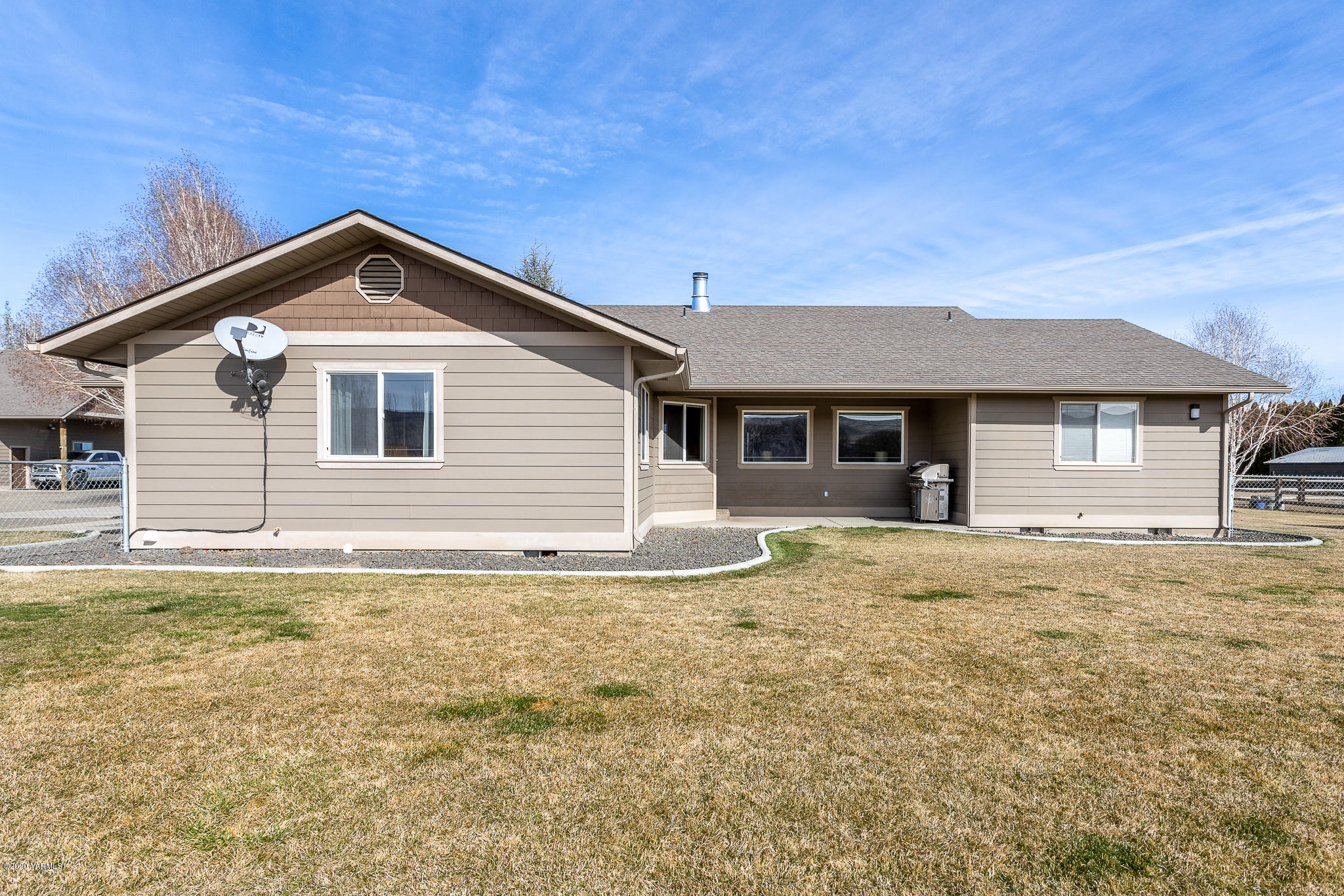 12100 Rutherford Road Yakima, WA 98903 - Photo 7 of 36 a view of a house with a yard