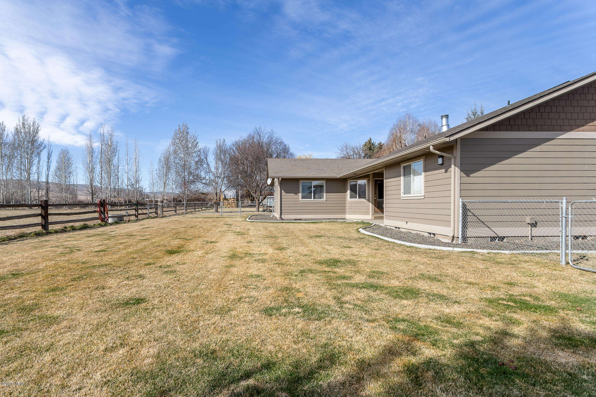 12100 Rutherford Road Yakima, WA 98903 - Photo 9 of 36 a view of a house with a yard
