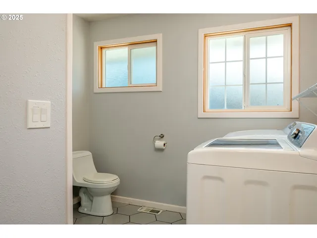 a bathroom with a sink a mirror and a shower