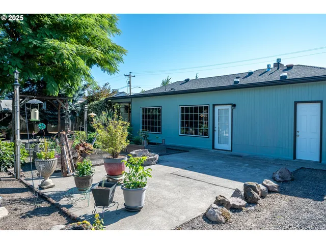a view of a backyard with sitting area
