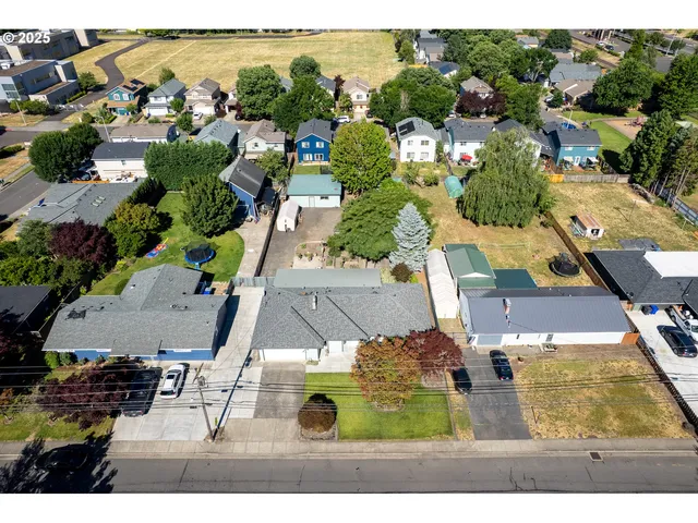 an aerial view of residential houses with outdoor space