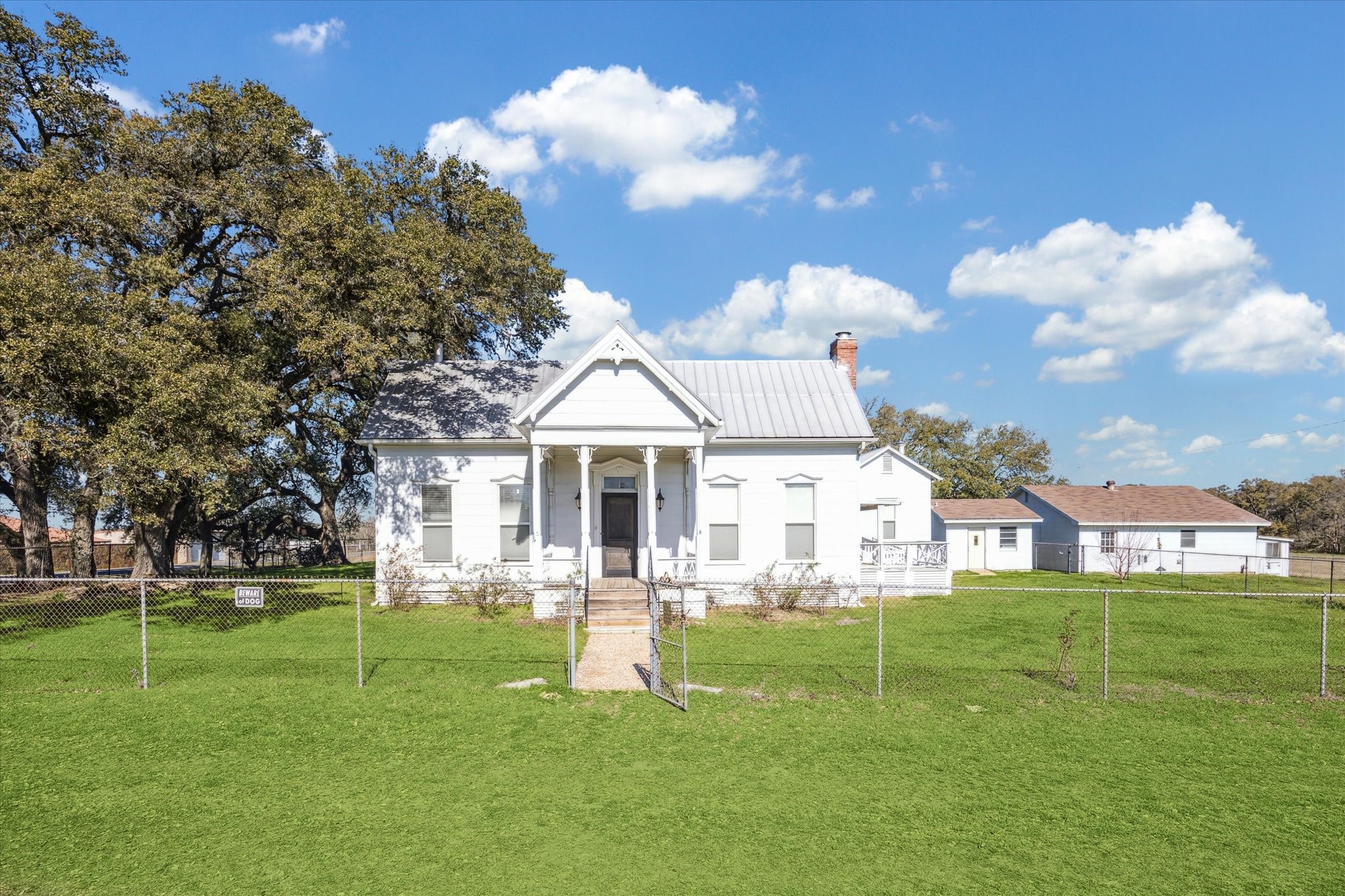 1118 Fm 1697 Burton, TX 77835 - Photo 1 of 31 a view of a white house in a big yard with palm trees