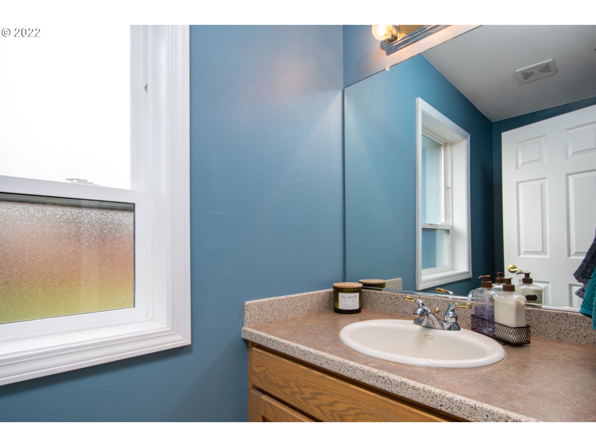2055 South Sevier Road Ridgefield, WA 98642 - Photo 17 of 31 a bathroom with a sink and a mirror