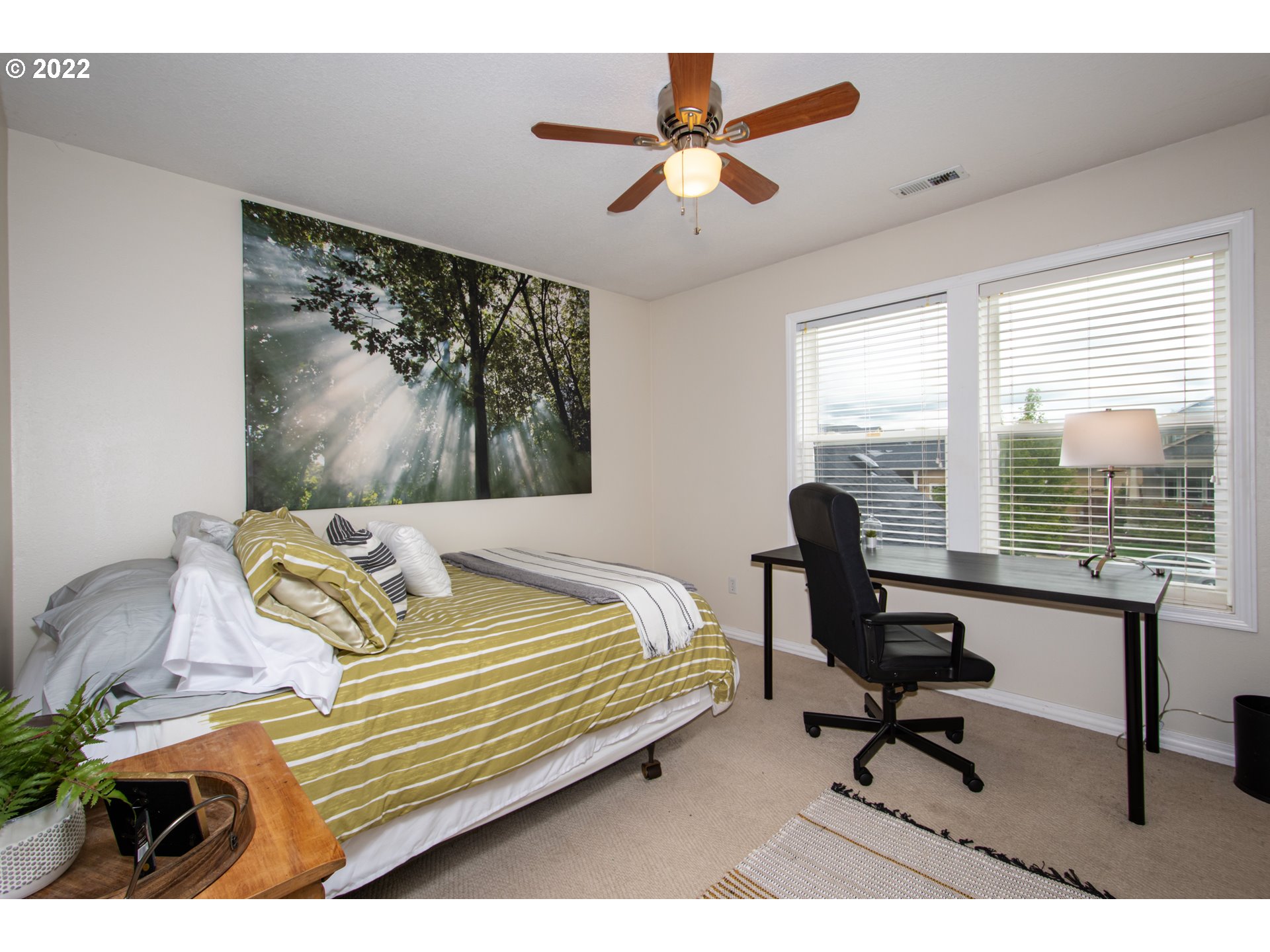 2055 South Sevier Road Ridgefield, WA 98642 - Photo 18 of 31 a bedroom with a bed a chair and a large window
