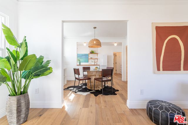 a view of a workspace with furniture and a potted plant