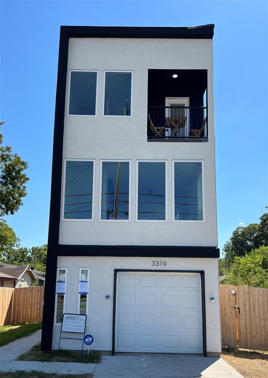 3319 South Haskell Avenue Dallas, TX 75223 - Photo 1 of 1 a front view of a house with a balcony