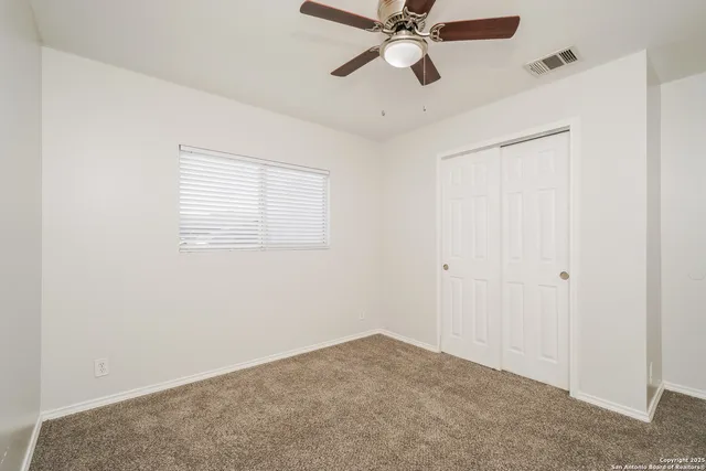 a view of an empty room and window