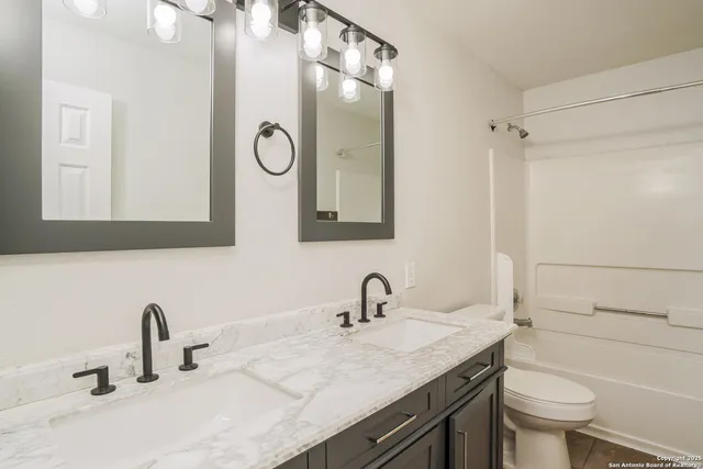 a bathroom with a sink and a toilet
