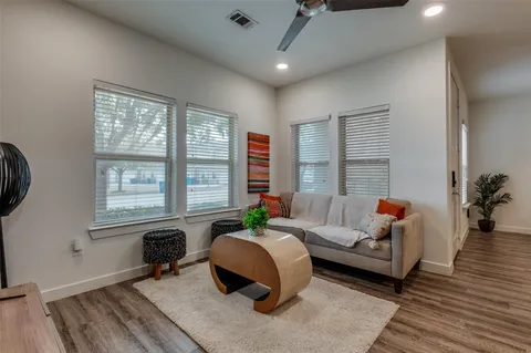a kitchen with stainless steel appliances kitchen island granite countertop a sink refrigerator and cabinets