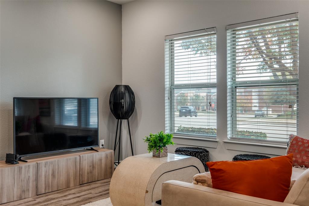 349 Tonga Street Dallas, TX 75203 - Photo 15 of 40 a living room with furniture and a flat screen tv
