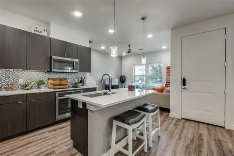 a bedroom with a bed dresser and a window