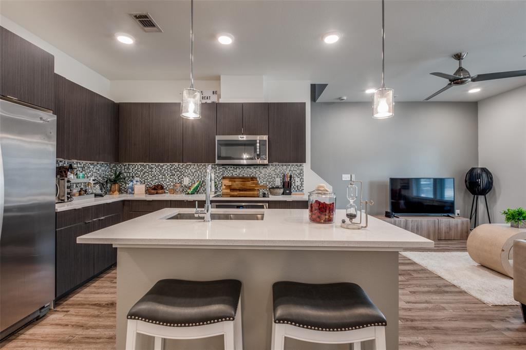 349 Tonga Street Dallas, TX 75203 - Photo 17 of 40 a kitchen with a sink cabinets and wooden floor