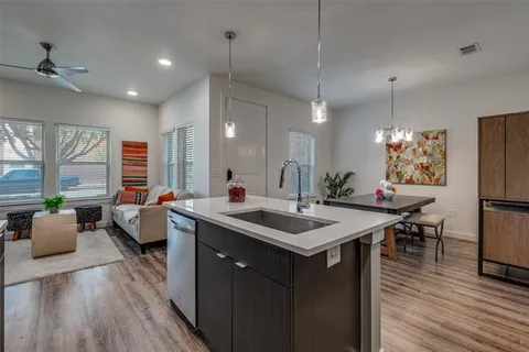 a bathroom with a sink a toilet and shower curtain
