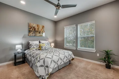 a bedroom with a bed and lamp