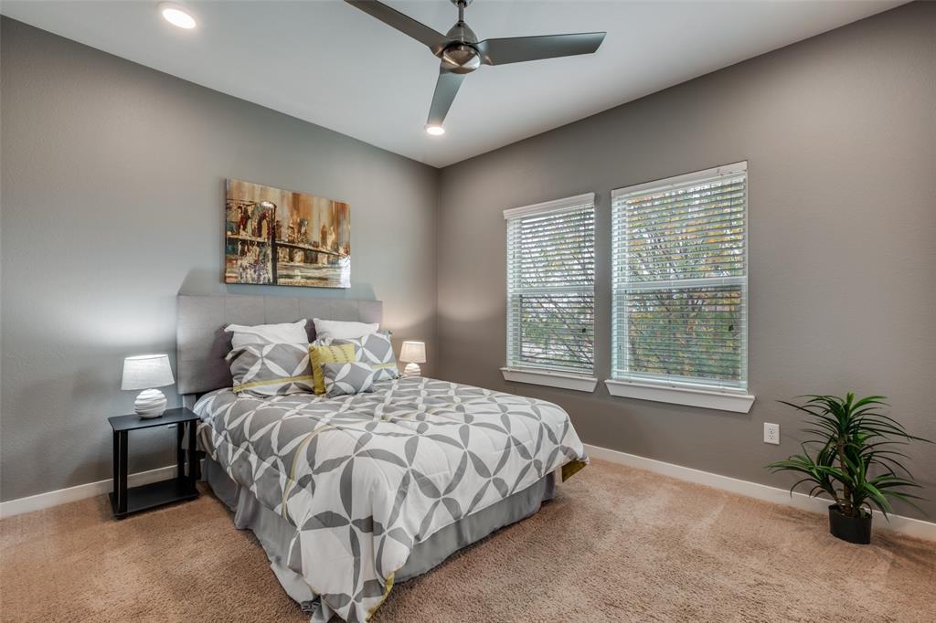 349 Tonga Street Dallas, TX 75203 - Photo 24 of 40 a bedroom with a bed dresser and a window