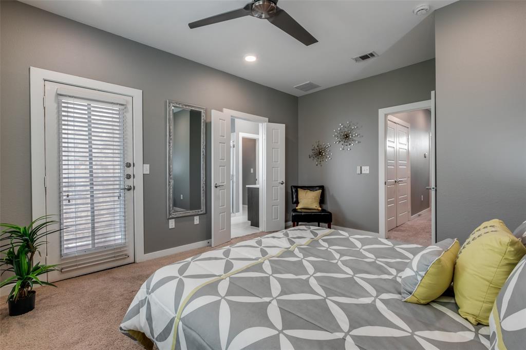 349 Tonga Street Dallas, TX 75203 - Photo 25 of 40 a bedroom with a bed and a chandelier