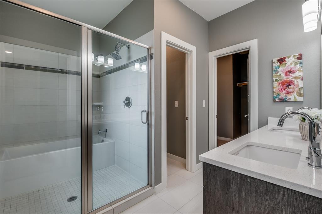 349 Tonga Street Dallas, TX 75203 - Photo 26 of 40 a bathroom with a granite countertop shower a mirror and a sink