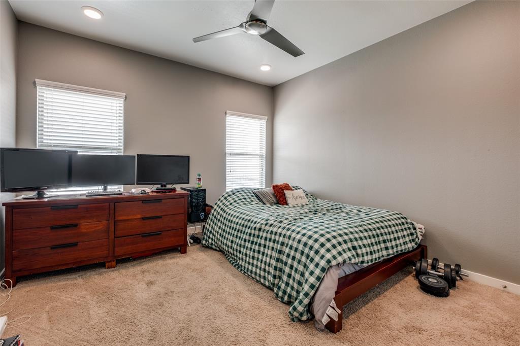 349 Tonga Street Dallas, TX 75203 - Photo 29 of 40 a bedroom with a bed and a window