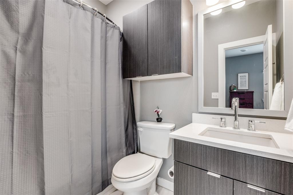 349 Tonga Street Dallas, TX 75203 - Photo 33 of 40 a bathroom with a sink a toilet and shower