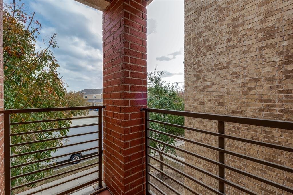 349 Tonga Street Dallas, TX 75203 - Photo 35 of 40 a view of balcony with wooden floor and fence