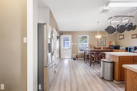 a view of a livingroom with furniture and book shelf