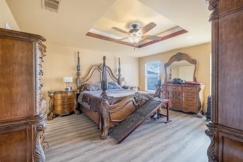 a kitchen with a sink appliances and cabinets