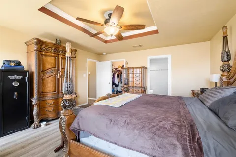 a bedroom with bed and a dresser