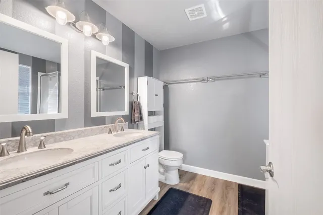 a very nice looking room with a large window and wooden floor