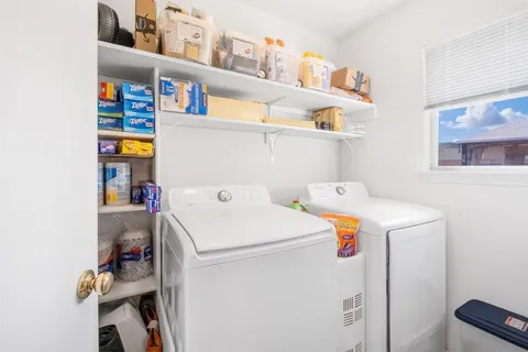 a bathroom with a granite countertop sink a toilet a mirror and shower