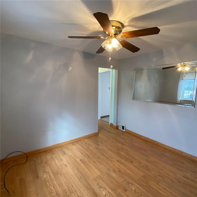 1438 Homestead Road Verona, PA 15147 - Photo 13 of 23 wooden floor in an empty room