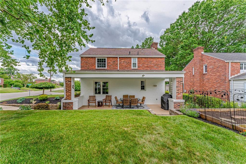 495 Old Farm Road Pittsburgh, PA 15228 - Photo 24 of 25 a front view of a house with garden and sitting area