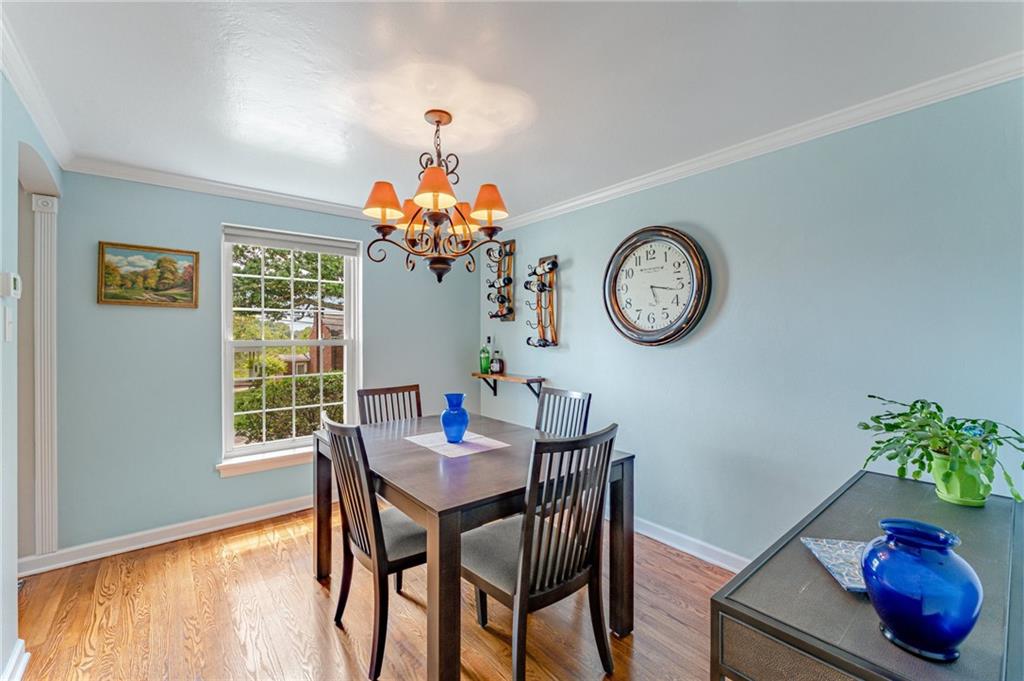 495 Old Farm Road Pittsburgh, PA 15228 - Photo 6 of 25 a view of a dining room with furniture and a chandelier