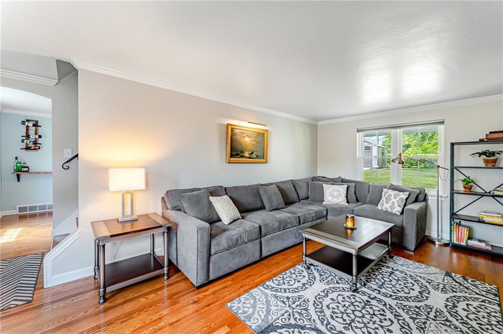 495 Old Farm Road Pittsburgh, PA 15228 - Photo 9 of 25 a living room with furniture and a wooden floor