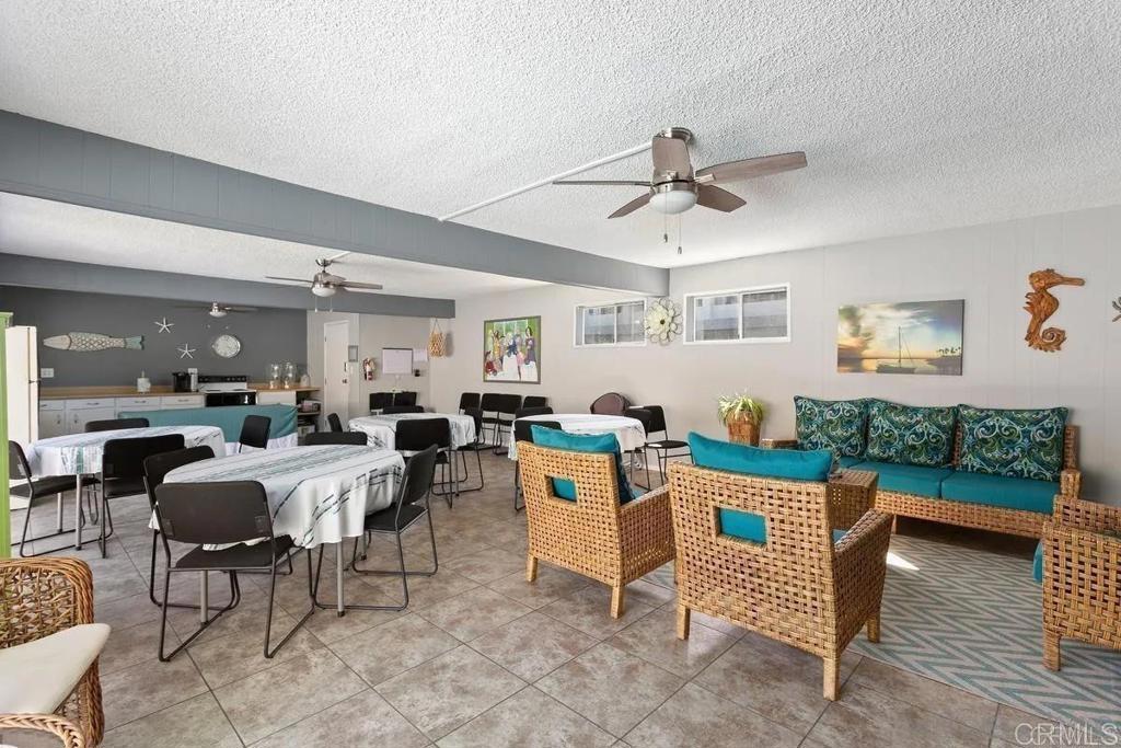3606 Vista Rey, Unit 37 Oceanside, CA 92057 - Photo 37 of 45 a living room with furniture and a wooden floor