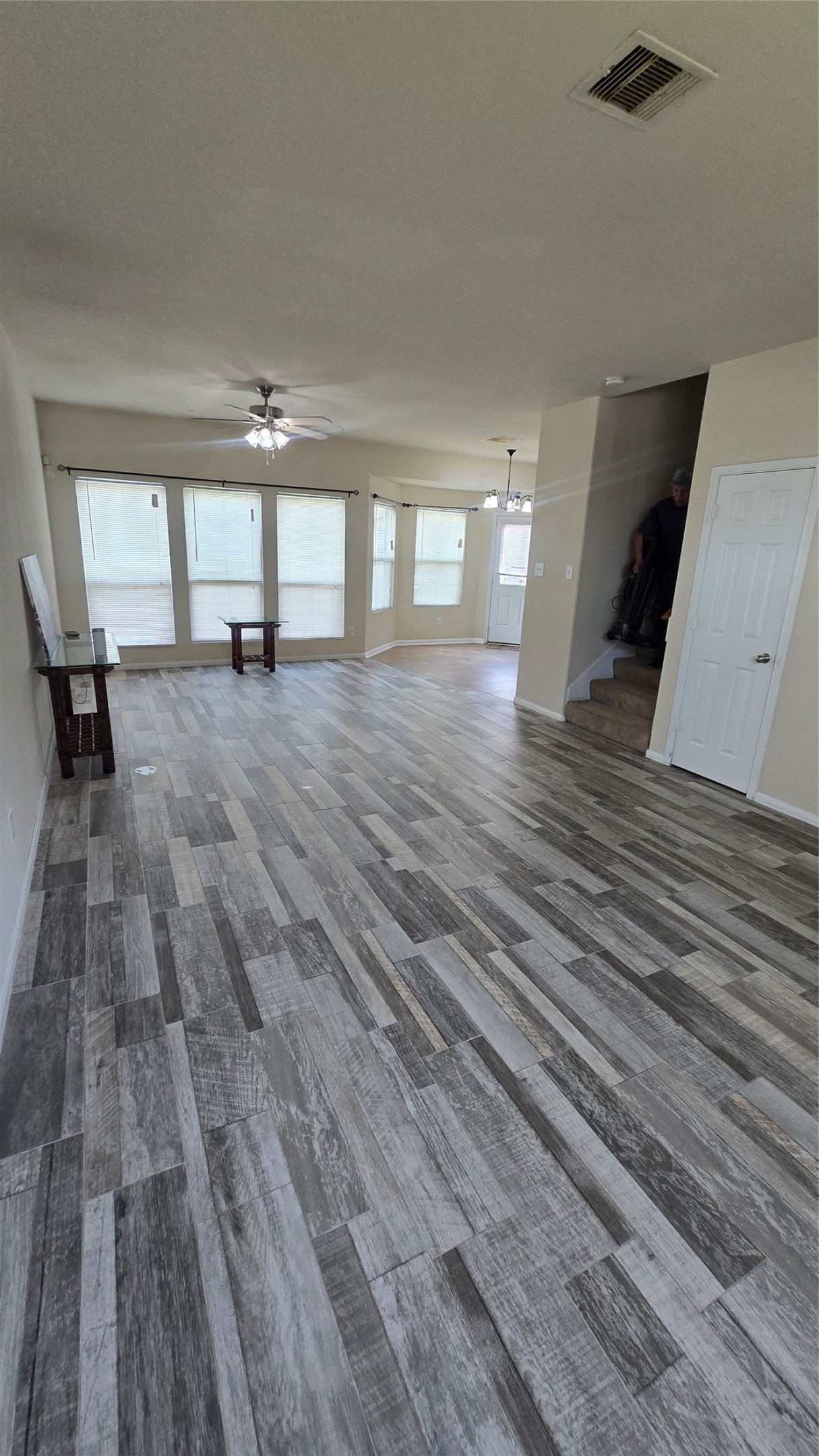 14819 Isle Of Pines Court Houston, TX 77049 - Photo 4 of 14 a view of empty room with wooden floor and fan