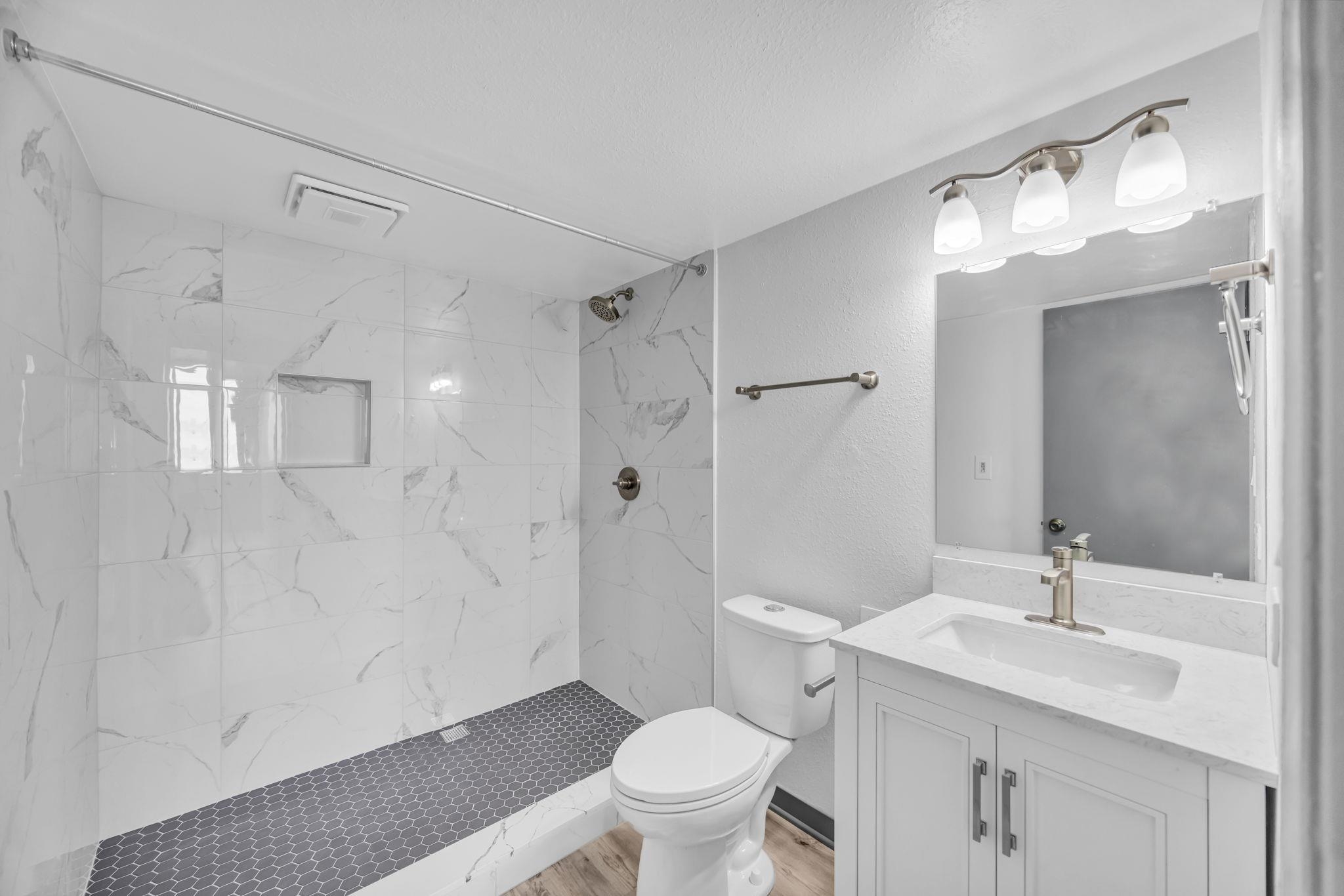 111 Kahului Beach Road, Unit A310 Kahului, HI 96732 - Photo 16 of 24 a bathroom with a sink a toilet and shower
