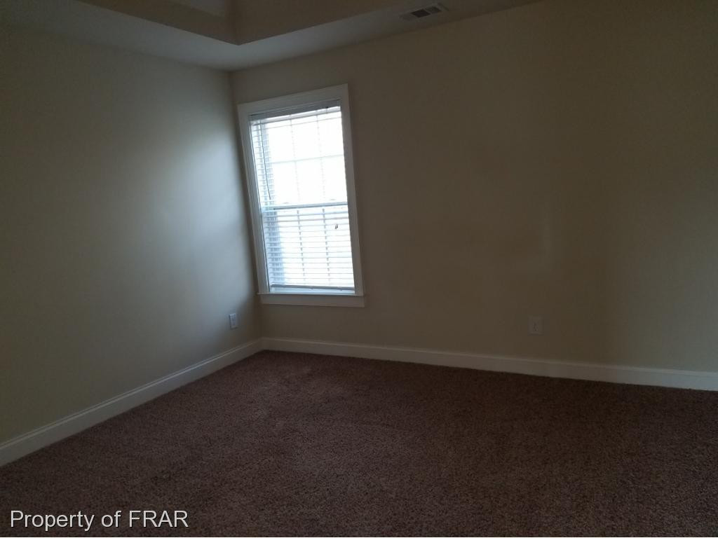 355 Regimental Drive Cameron, NC 28326 - Photo 14 of 19 an empty room with a window