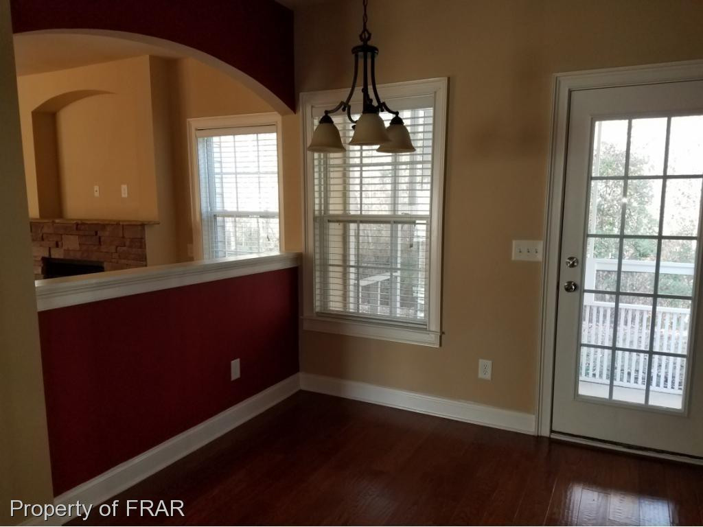 355 Regimental Drive Cameron, NC 28326 - Photo 6 of 19 an empty room with wooden floor and windows