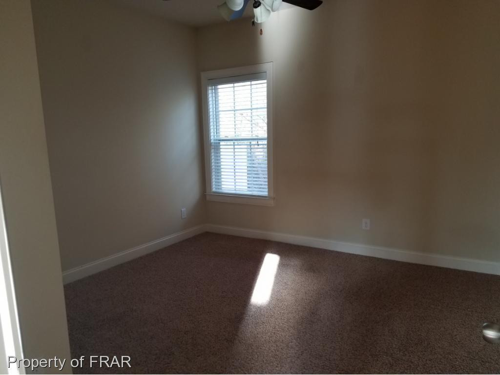 355 Regimental Drive Cameron, NC 28326 - Photo 8 of 19 an empty room with a window