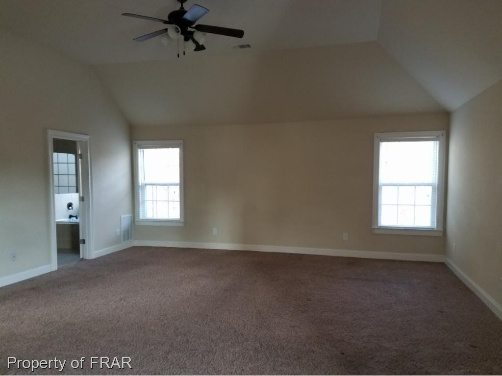355 Regimental Drive Cameron, NC 28326 - Photo 9 of 19 an empty room with a window