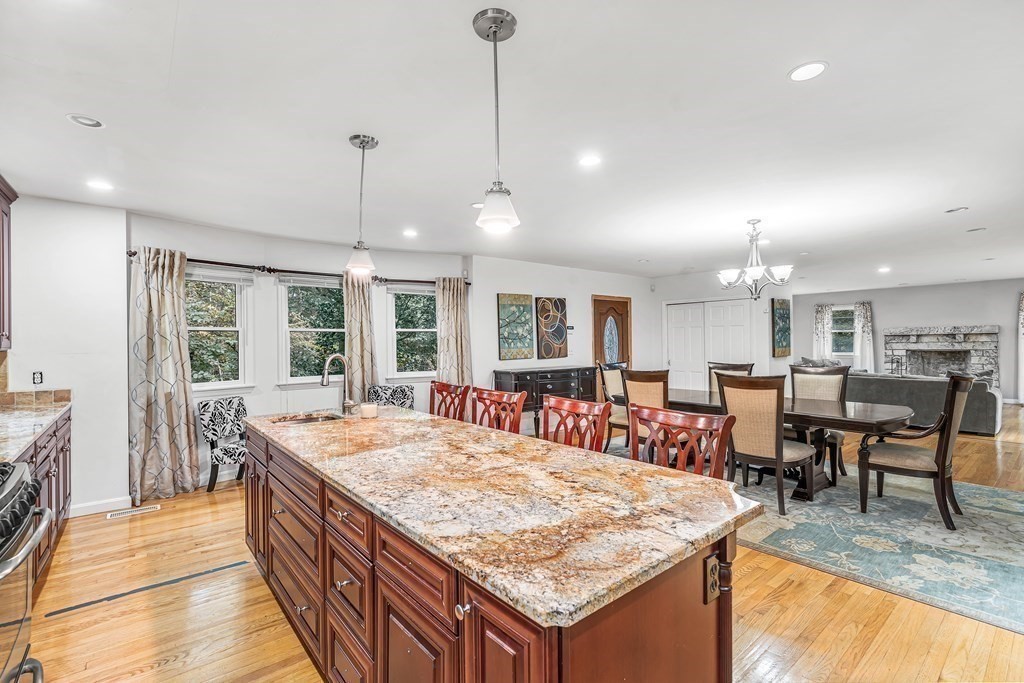 3 Goodnow Road Sudbury, MA 01776 - Photo 11 of 34 a large kitchen with kitchen island a sink table and chairs