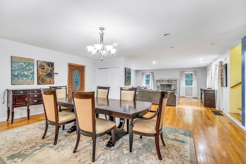 3 Goodnow Road Sudbury, MA 01776 - Photo 9 of 34 a view of a dining room with furniture and a chandelier